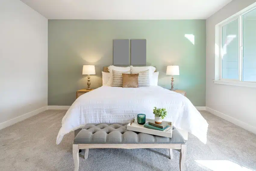 Bed with grey tufted bench, two nightstands and lamps
