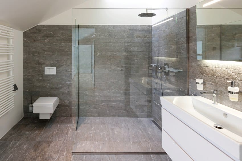 Bathroom with slate shower design and white floating vanity