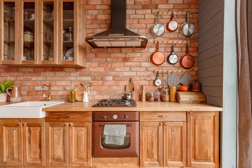 Cozy kitchen interior of a country house in a wooden design with rustic kitchen backsplash