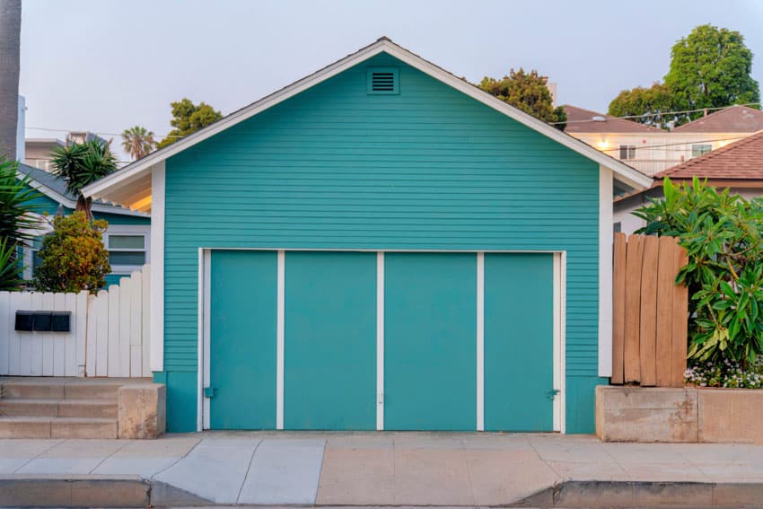 Detached garage with siding and doors