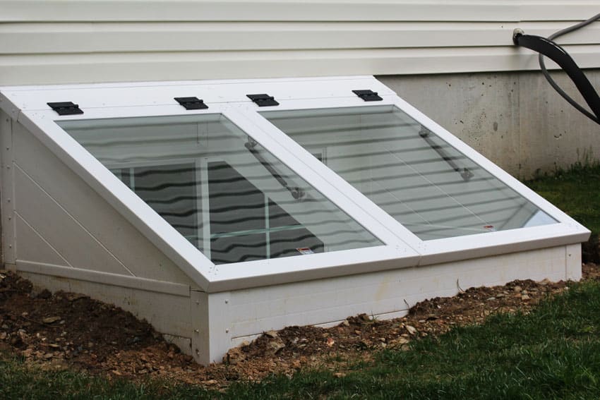 House exterior with glass guards for basement windows