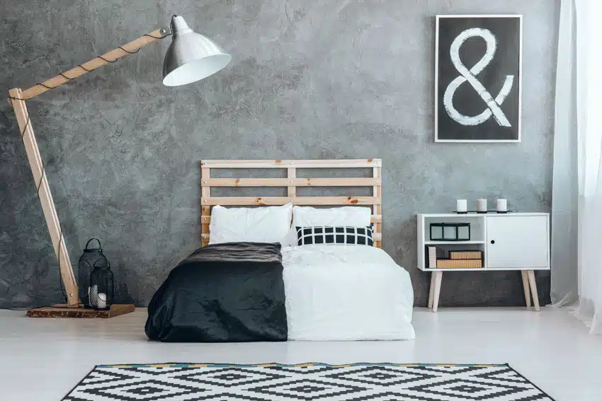 Industrial space with textured wall and wood pallet bed