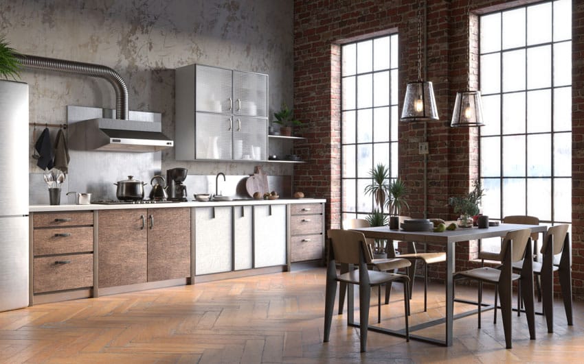 Industrial kitchen with dining space, table, chairs, windows, cabinets, range hood, floating shelves, and pendant lights