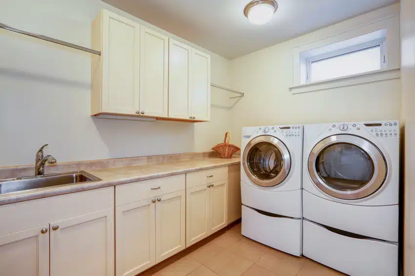 Laundry room with washer and dryer, countertop and cabinets