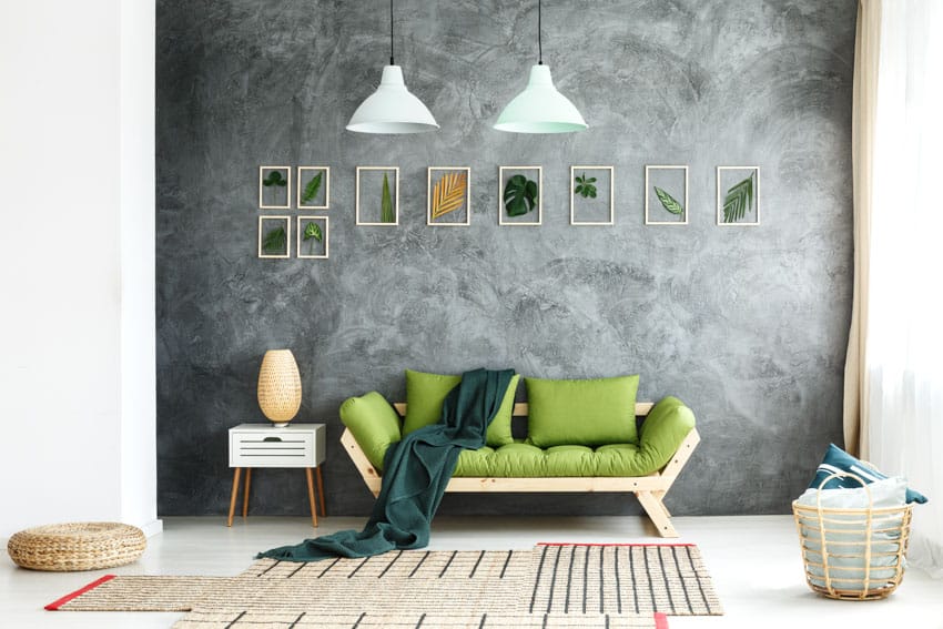 Lime green sette and concrete wall with framed wall art