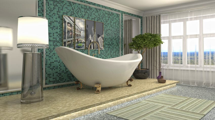 Modern kitchen with tub, lamp, mosaic tile accent wall, window, indoor plant, and brass clawfoot tub feet