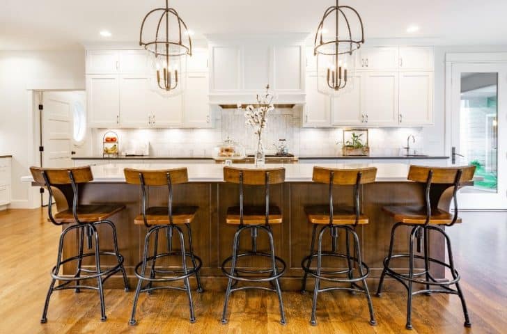 Colonial Kitchen Cabinets Door Styles Hardware   Rustic Modern Farmhouse Kitchen With White Colonial Cabinets Wrought Iron And Wood Chairs Eating Counter And Light Fixtures Is 728x480 