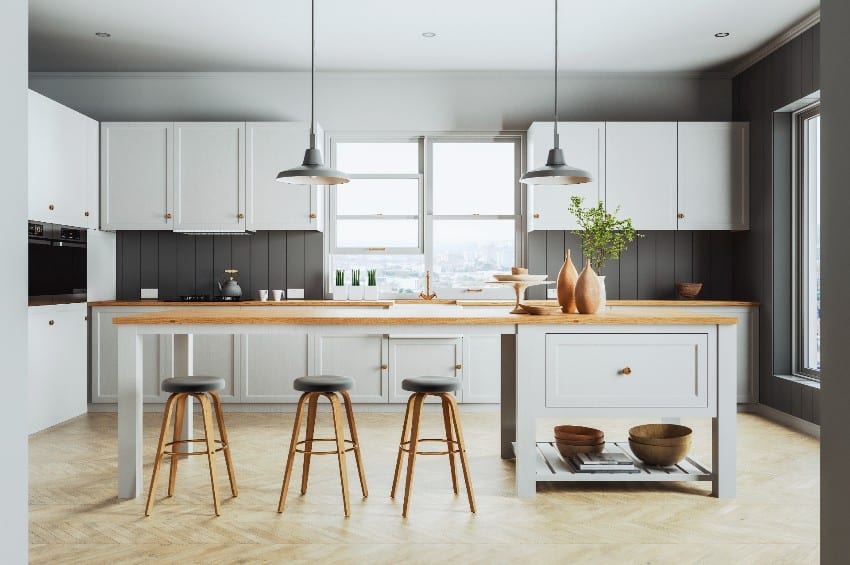 Scandinavian kitchen interior with light gray wooden cabinets and kitchen island cabinet with legs and stools