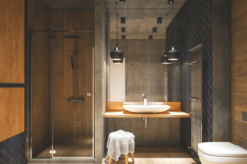 Stylish industrial bathroom interior with vinyl tile shower walls, sink and pendant lights