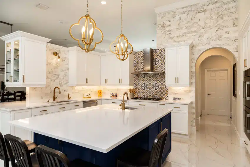 Transitional Kitchen With Spanish Tile Backsplash Island Countertops White Cabinets Sink Faucet And Pendant Lights Ss .webp