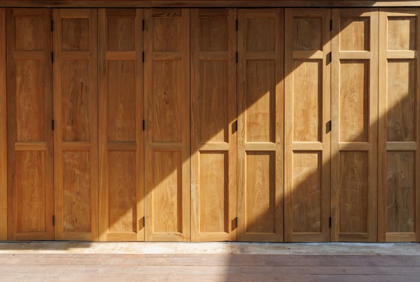 Wood bifold garage door kit for residential properties