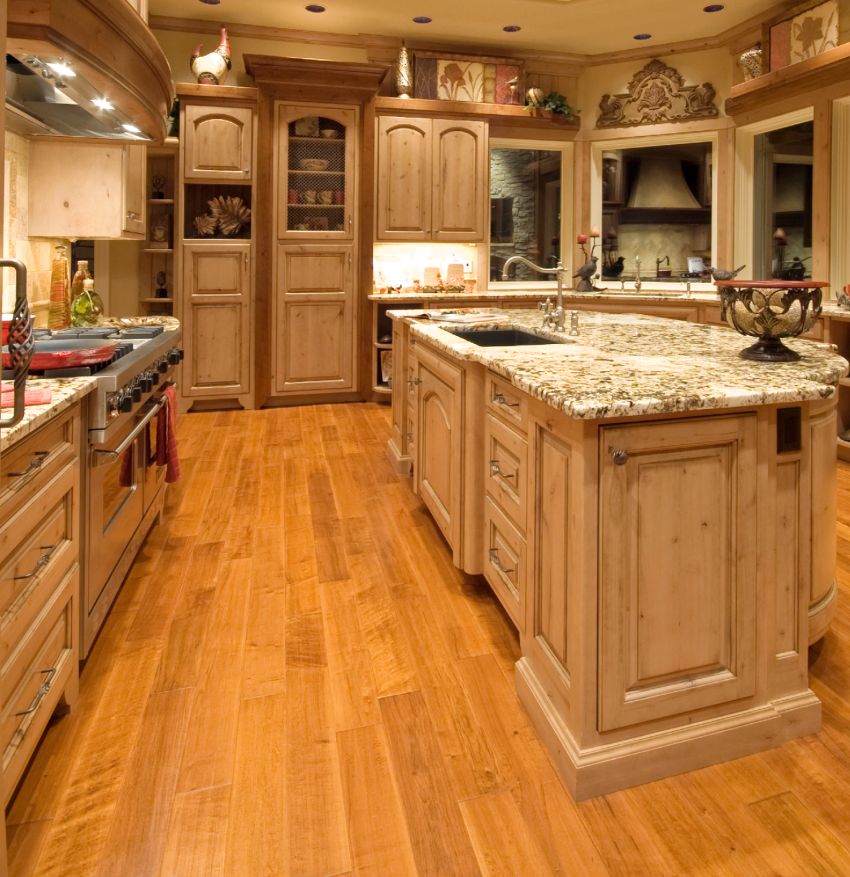 Wooden kitchen interior features kitchen island cabinets with legs and granite countertops