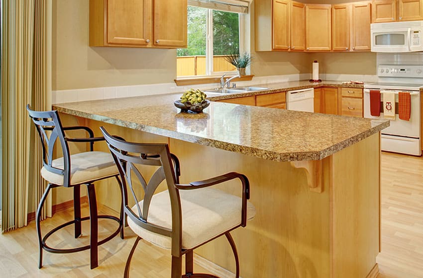 Kitchen counter with steel stools, cabinet, window, wood floors, and granite countertop