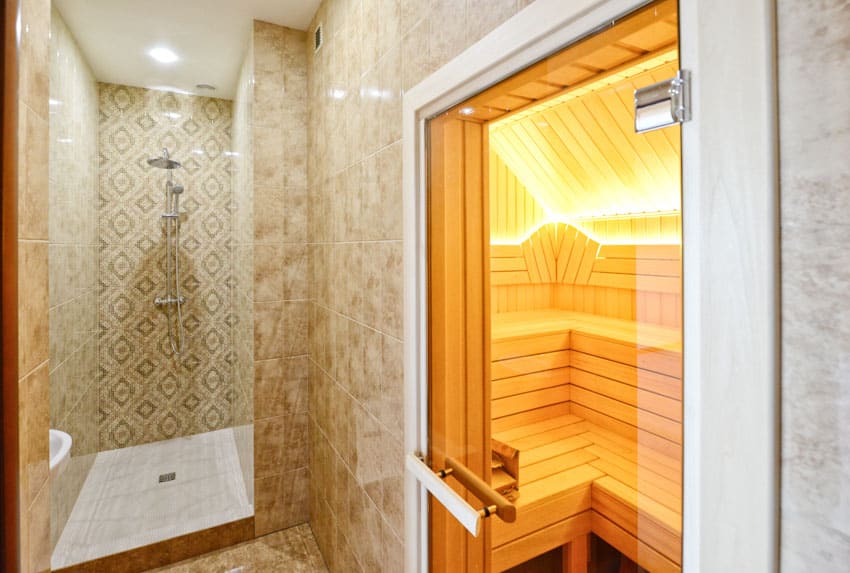Bathroom with 2 person shower sauna combo, patterned tile backsplash, glass door, and ceiling lights