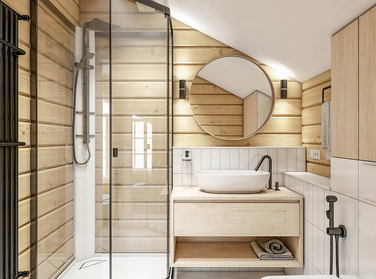 Bathroom with shiplap shower, mirror, sink, faucet, glass door, and wall light fixtures