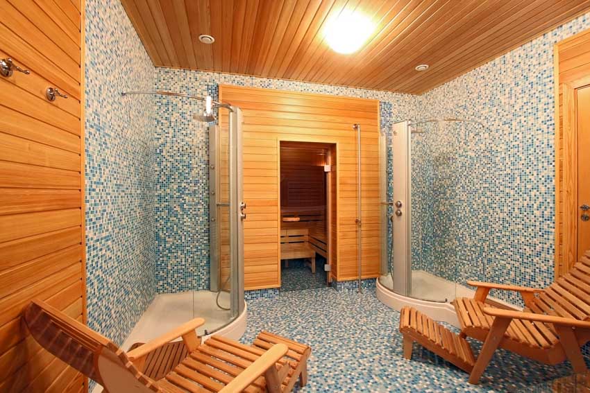 Bathroom with shower sauna combo, wood chairs, glass enclosures, textured wall finish, and wood beadboard ceiling