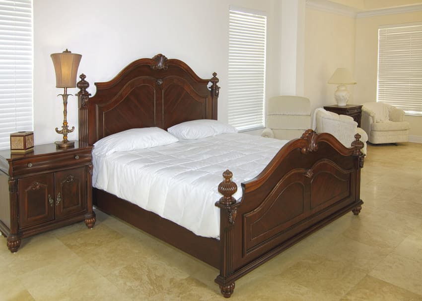 Bedroom with jackwood Indian furniture, headboard, footboard, nightstand, pillows, and mattress