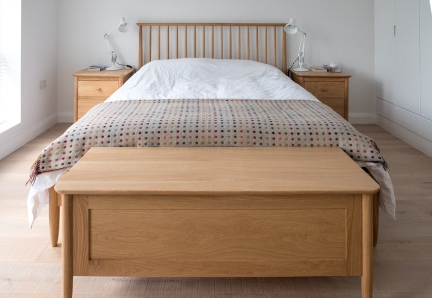 Bedroom with wooden chest, nightstands and headboard