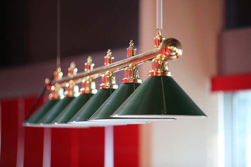 Billiard lights hanging from attic ceiling