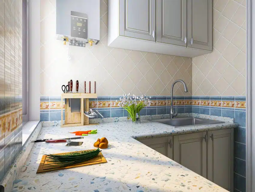 Bright kitchen with diamond tile backsplash, a l-shaped terrazzo 