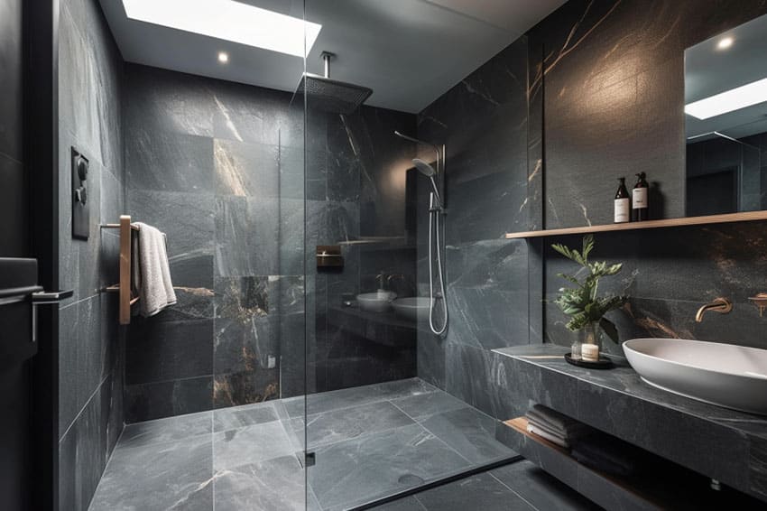 Smooth honed slate flooring and walls, white basin and open shelving