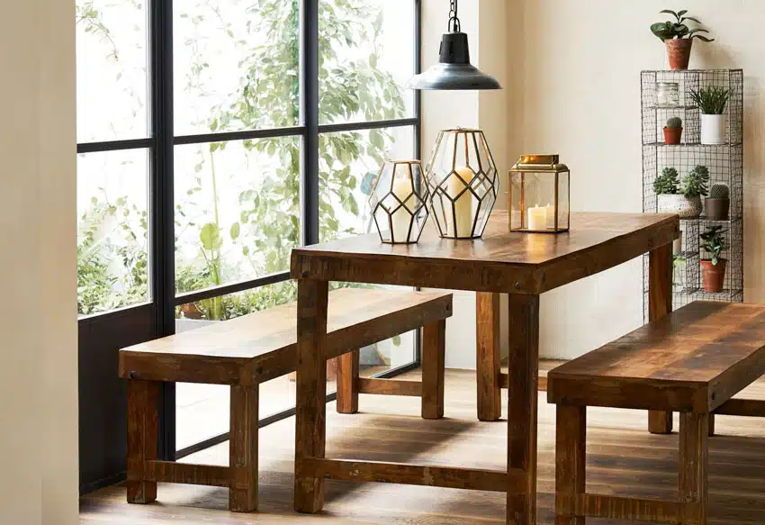 Dining table made of coconut wood, bench, windows, and freestanding shelves