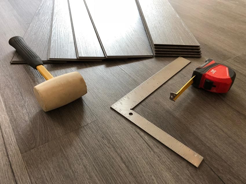 Vinyl flooring planks with tools to install them
