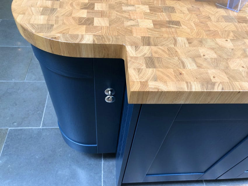 Kitchen with end grain teak wood countertop, cabinets, and tile floors