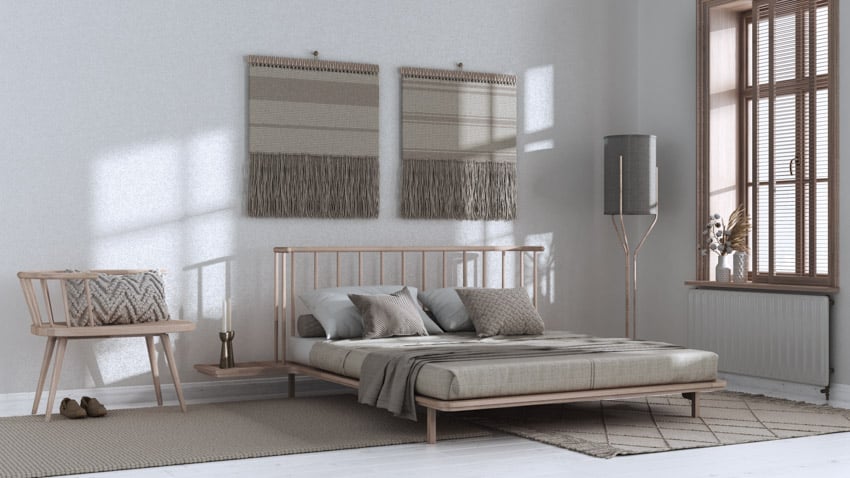 Minimalist bedroom with bleached oak wood chair, headboard, mattress, floor lamp, and windows