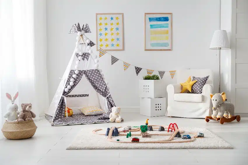 Minimalist playroom design with tent and toy railway