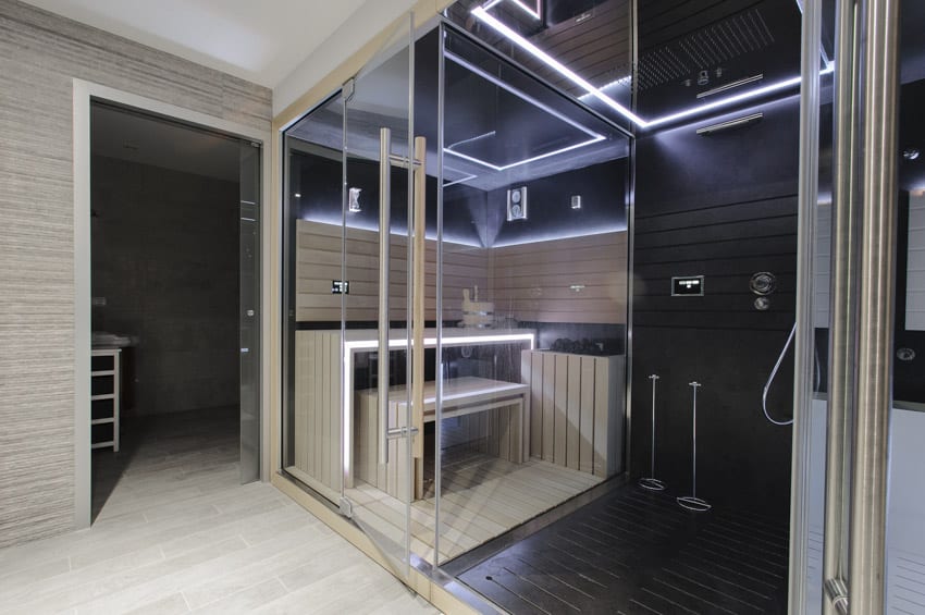 Modern bathroom with shower sauna combo, LED lighting fixtures, and wood plank floors