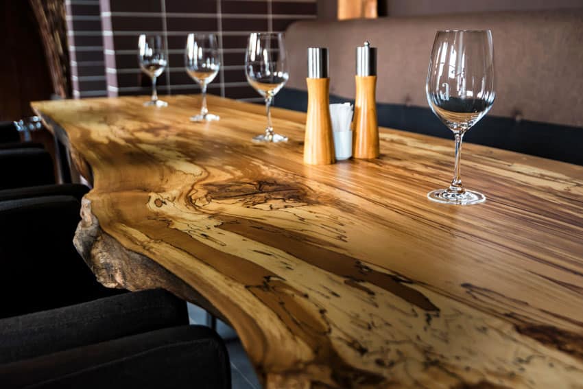 Mulberry wood live edge table and wine glasses