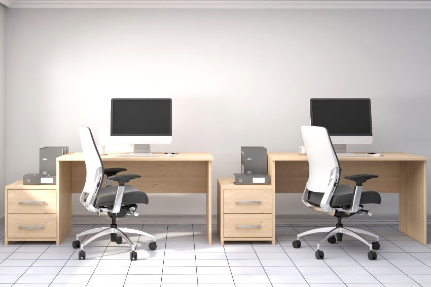 Office interior wit desks and ergonomic chairs