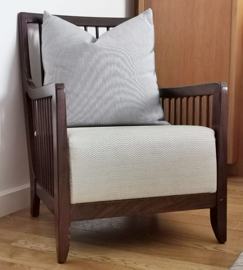 Old restored Stickley armchair with gray upholstery and pillow
