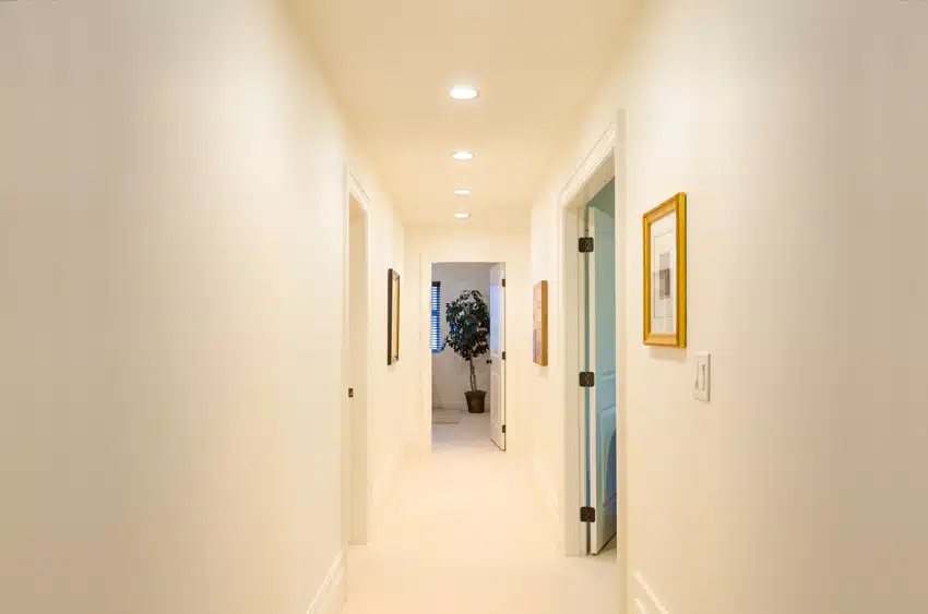 Small Hallway Light Fixtures Design Types Uses Designing Idea   Small Hallway With Recessed Lights White Walls And Doors Ss .webp