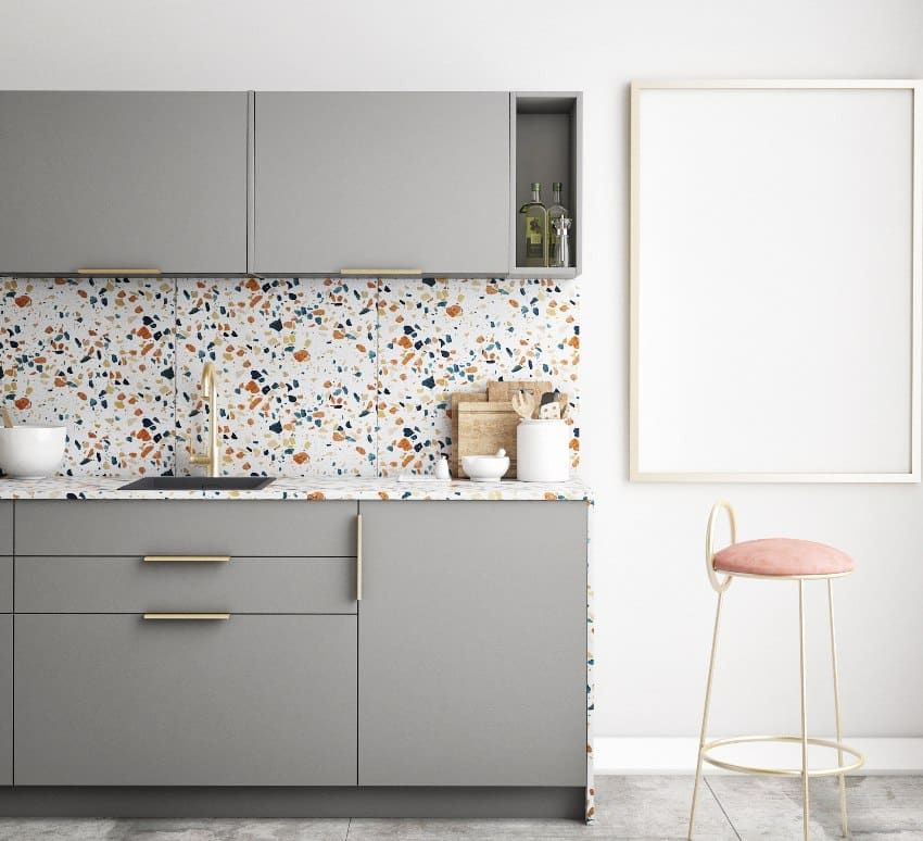 Small kitchen with gray cabinets, terrazzo kitchen countertop and backsplash