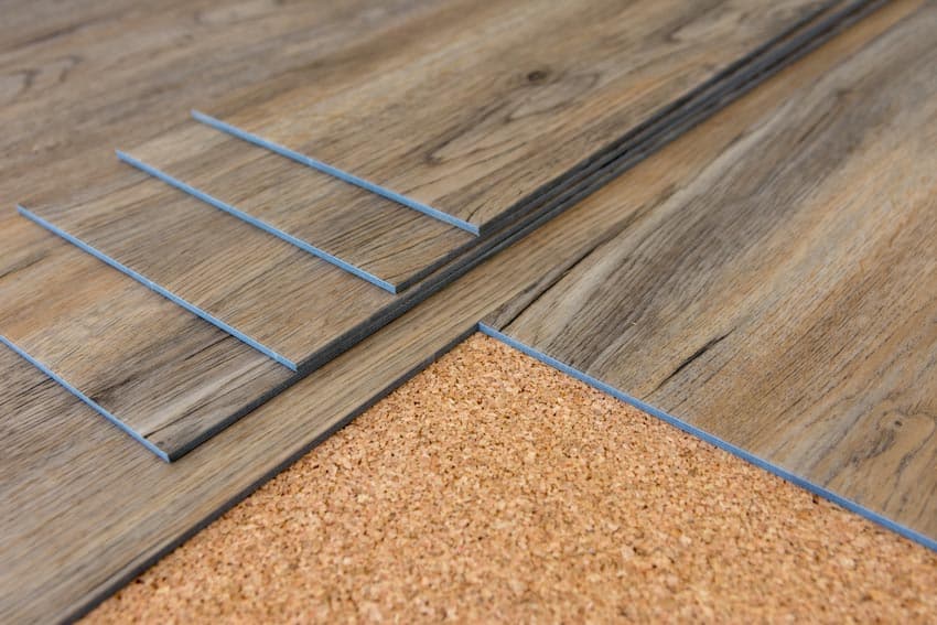 Wood look vinyl plank flooring on cork installation with foam back