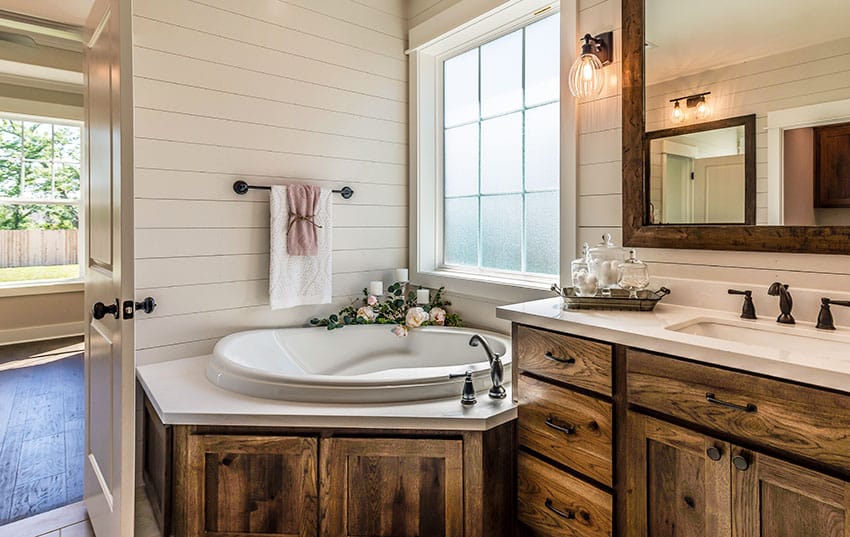 Bathroom with corner tub rustic cabinets vanity