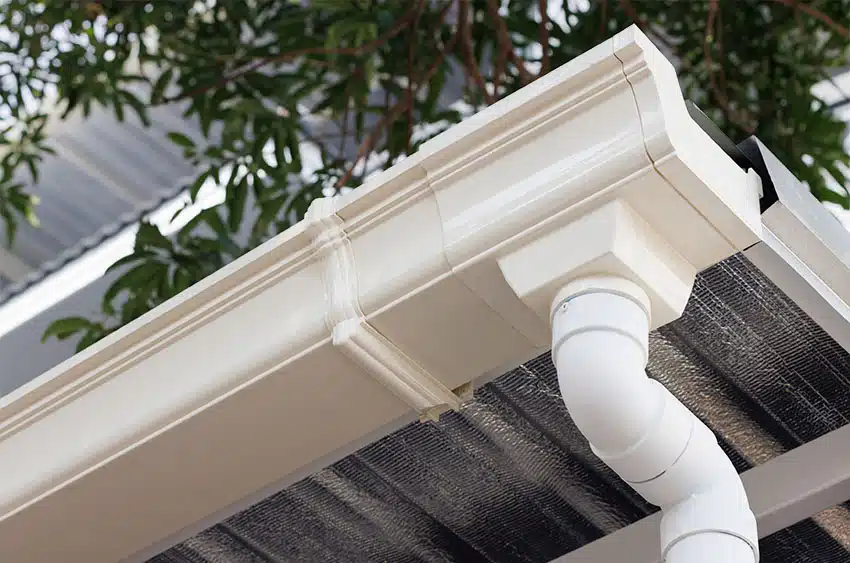 Roof gutter with round downspout roof insulation