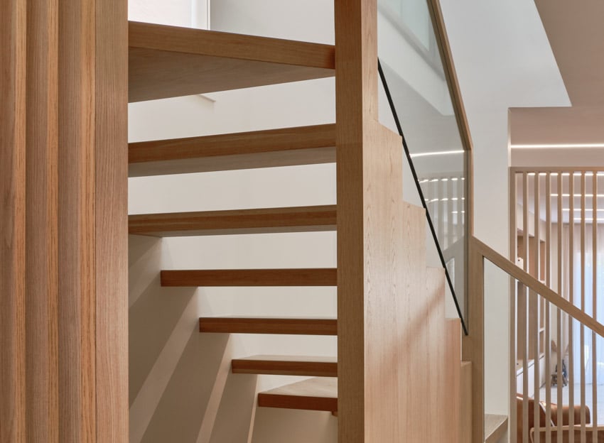 Harty house interior with floating staircase, and glass panels