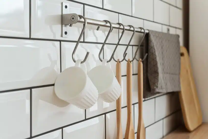Kitchen with subway tile backsplash and storage hooks