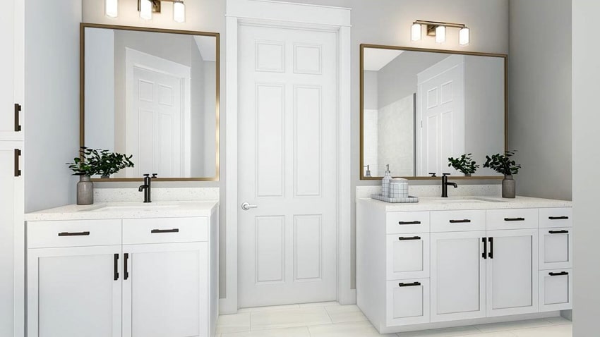 Modern farmhouse bathroom with vanity mirrors, countertop, cabinets, and cabinet hardware