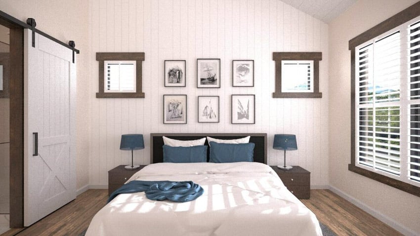 Modern farmhouse bedroom with nightstands, lamps, vertical shiplap wall, barn door, window, and blinds