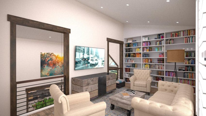 Modern farmhouse living room with bookshelves, couch, cushioned chairs, console cabinet, television, and ceiling lights