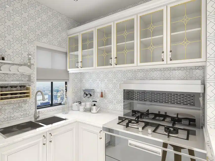Contemporary kitchen with tile backsplash, glass cabinets, countertop, and window