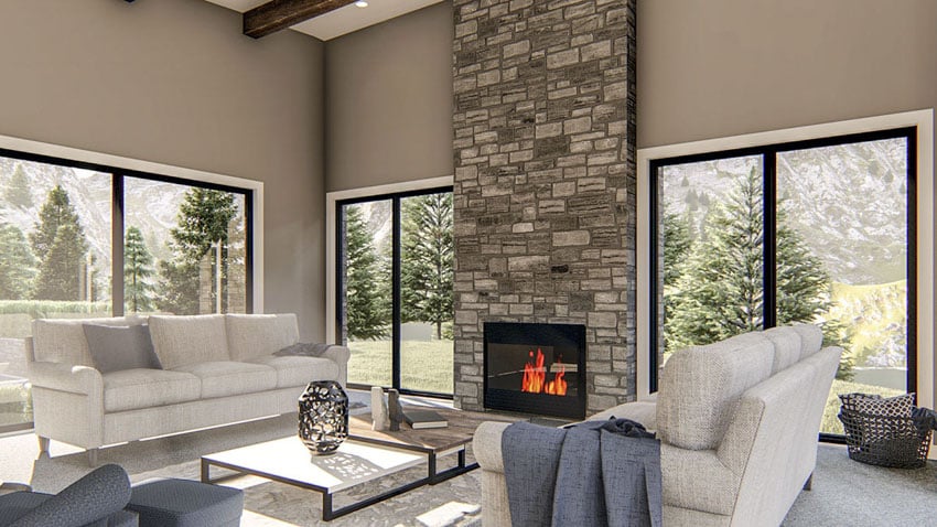 Living room with stone fireplace, and sofas