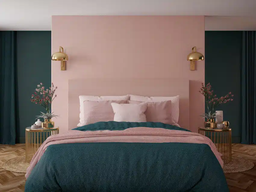Romantic bedroom with pale pink accent wall, pillows, comforter, nightstands, and green wall panels