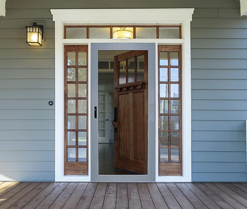 Wood door with screen and white brickmold and sidelight windows