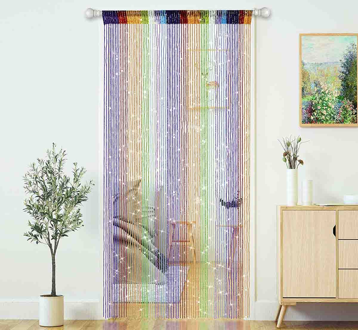 beaded curtain hanging over a rod