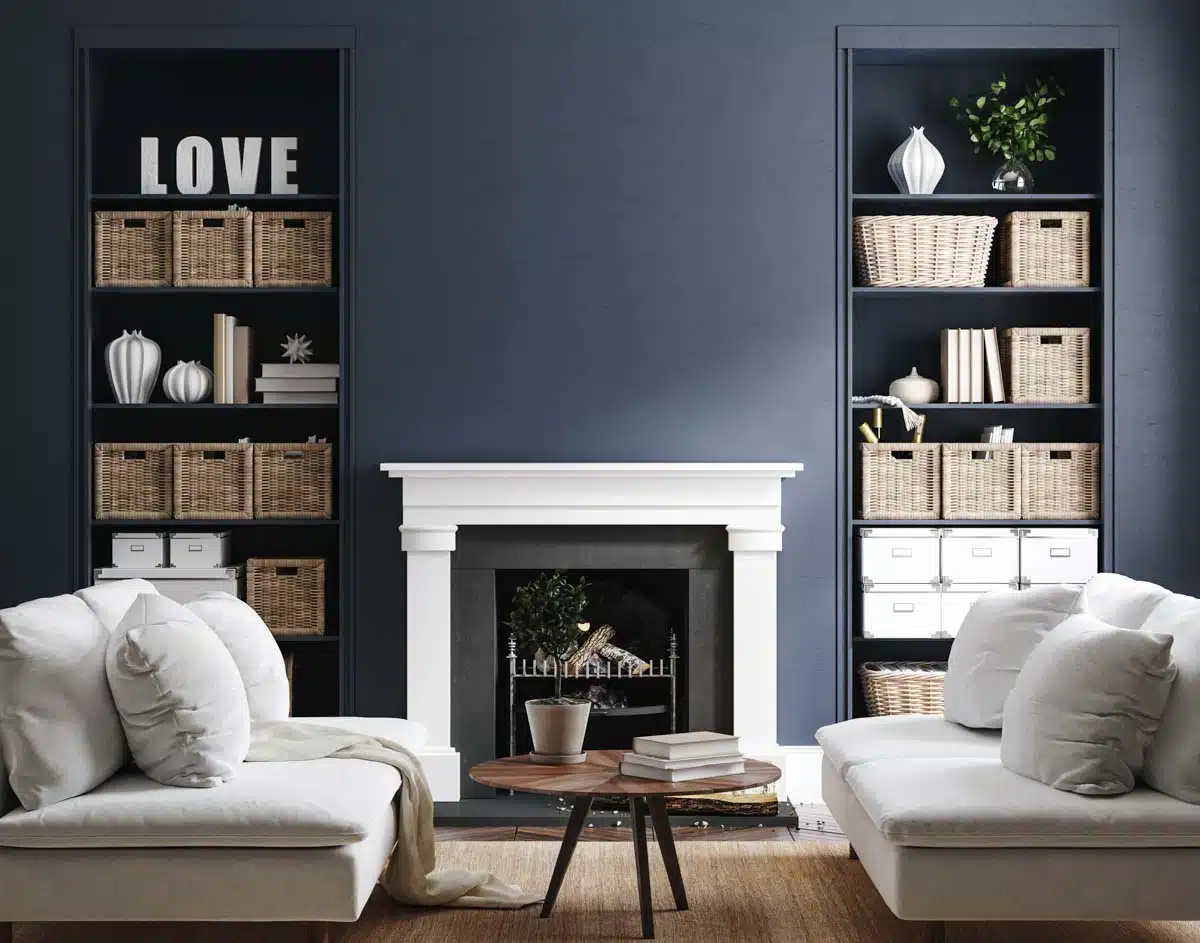 blue room with couch fireplace and shelves